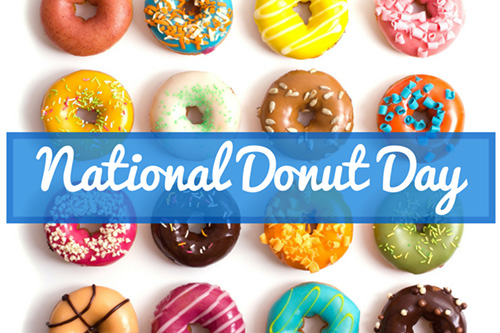 Assorted donuts with various toppings and colors displayed for National Donut Day.