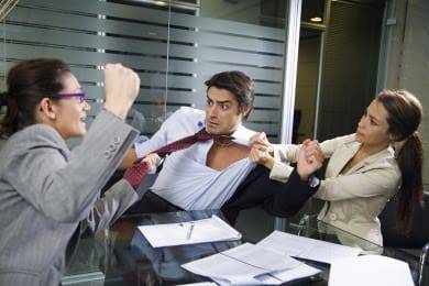Three office colleagues engaged in a physical altercation in a corporate setting.