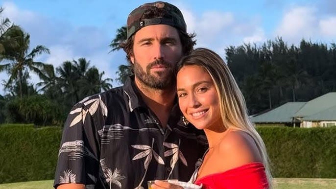 Brody Jenner posing with a companion outdoors, both smiling at the camera.