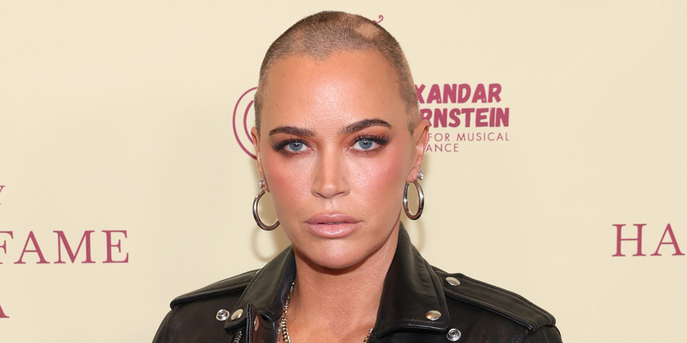 Teddi Mellencamp Arroyave with a shaved head and wearing a black leather jacket at an event.